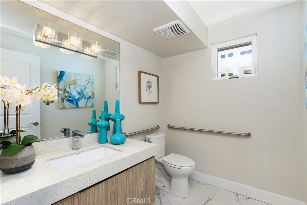 6 Bethpage Lane Phillips Ranch, CA 91766 - Photo 7 of 63 a bathroom with a sink a mirror and a toilet