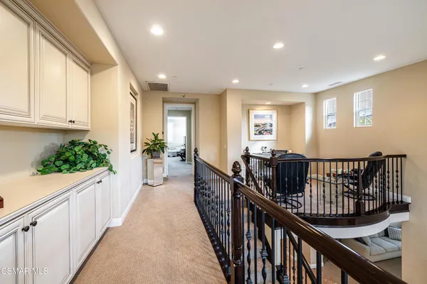 a view of entryway with wooden floor and stairs