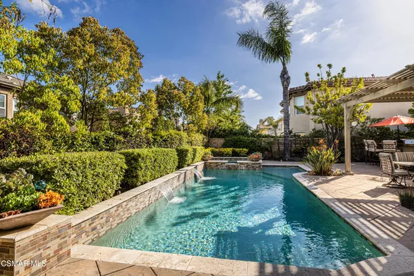 a view of swimming pool with a patio