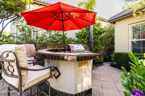a view of an outdoor sitting area with furniture and backyard