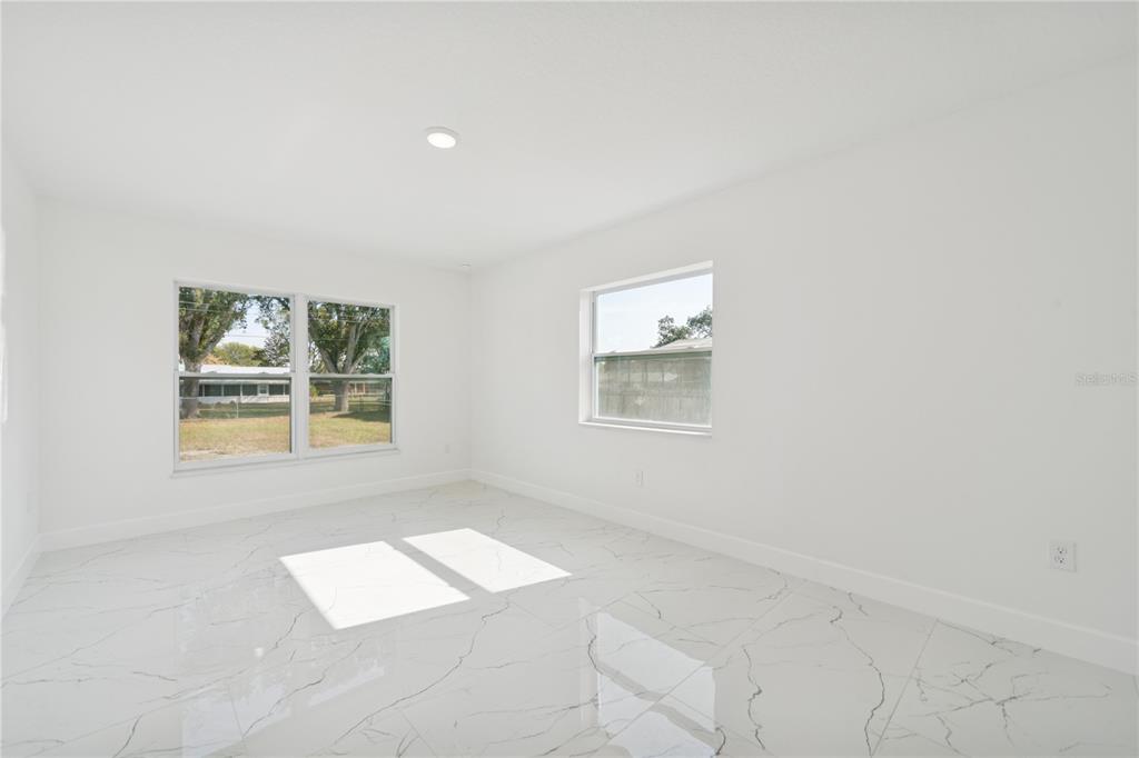 4033 Buttonbush Circle Lakeland, FL 33811 - Photo 14 of 33 an empty room with windows