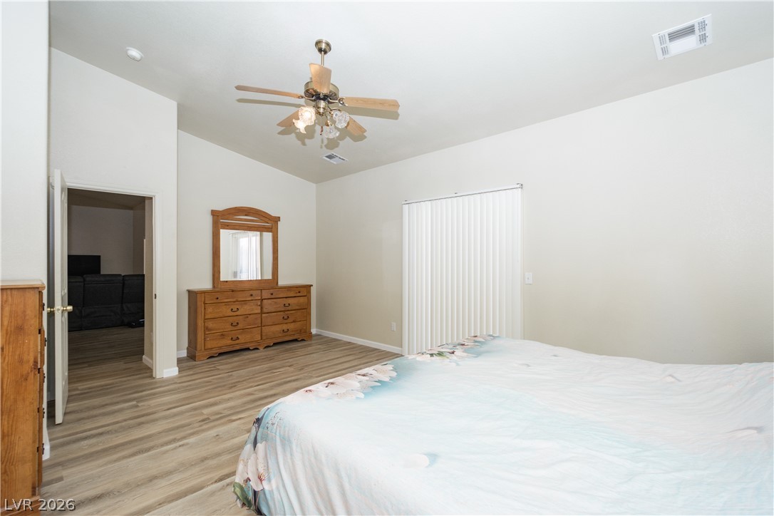 2381 Tough Boy Road Pahrump, NV 89060 - Photo 15 of 44 This airy bedroom features high ceilings and elegant flooring, creating a comfortable and spacious retreat.
