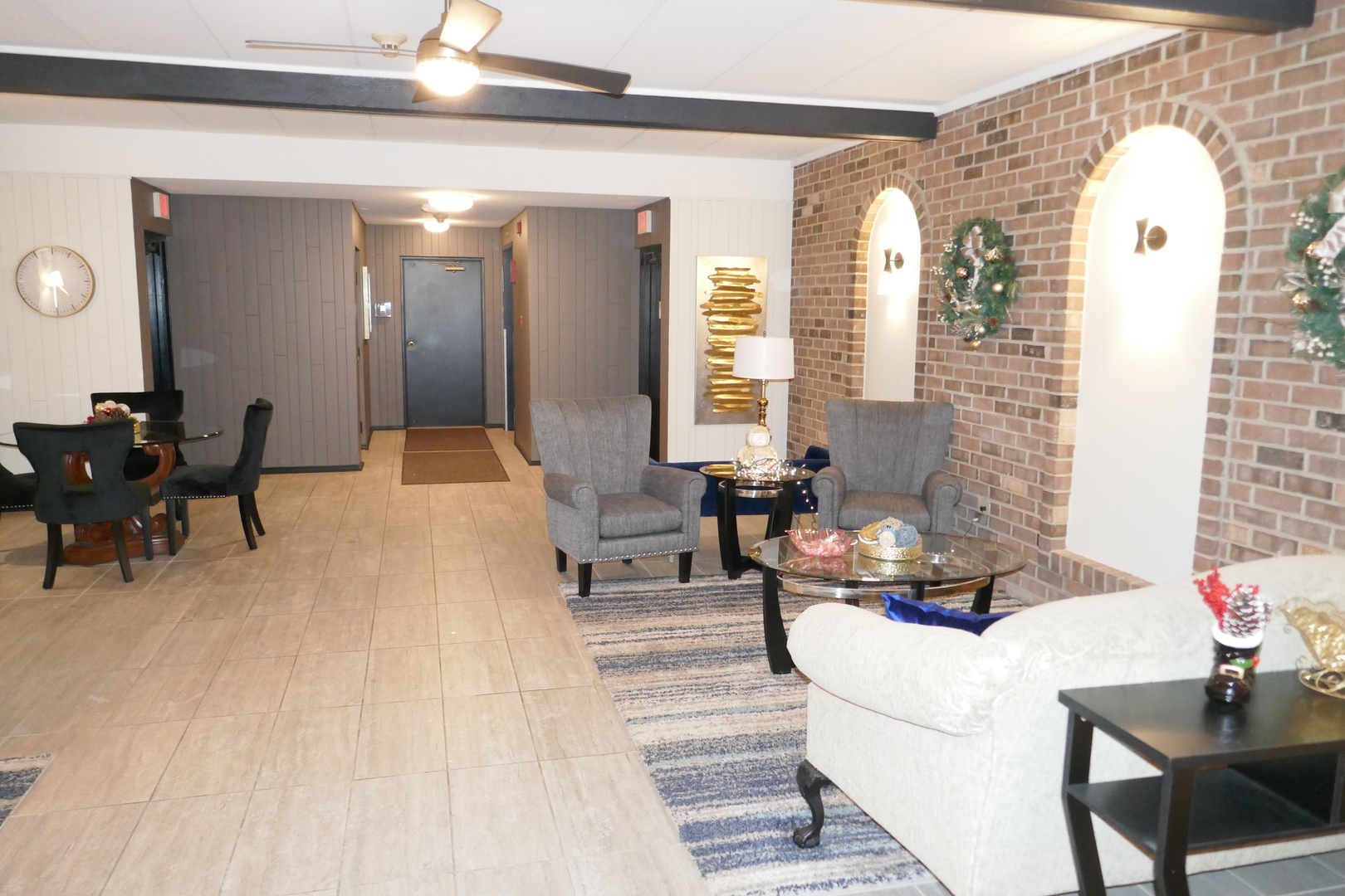 603 South River Road, Unit 2M Des Plaines, IL 60016 - Photo 2 of 20 a living room with furniture and wooden floor