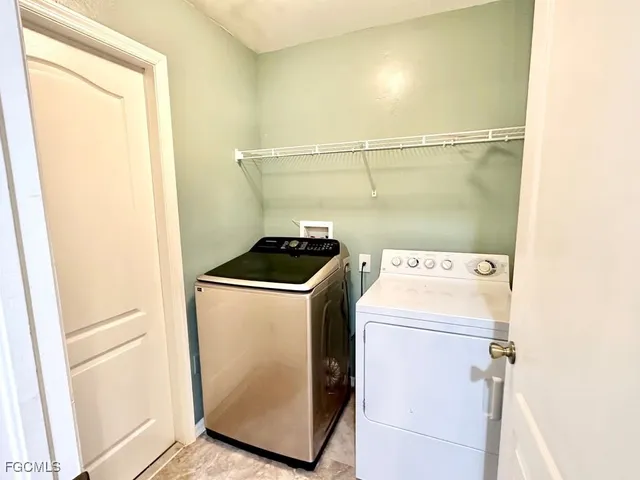 a utility room with dryer and washer