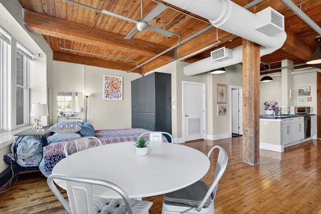 a bed room with bed and wooden floor