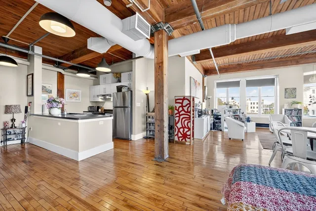 a view of a living room and kitchen