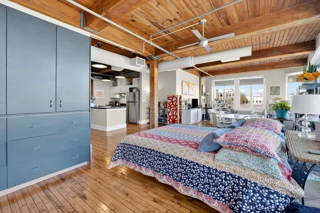 a bed room with a bed and a view of bedroom