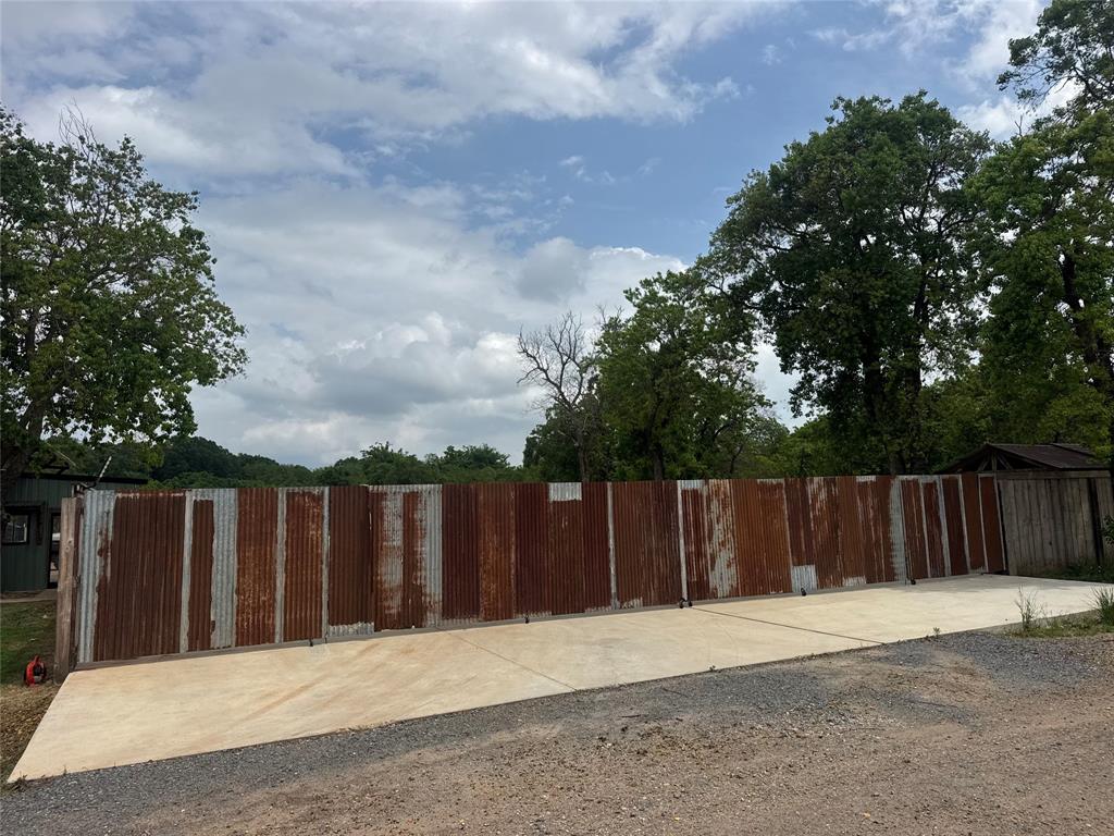 147 Wilson Loop Benton, LA 71006 - Photo 3 of 11 a wooden fence with trees in the background