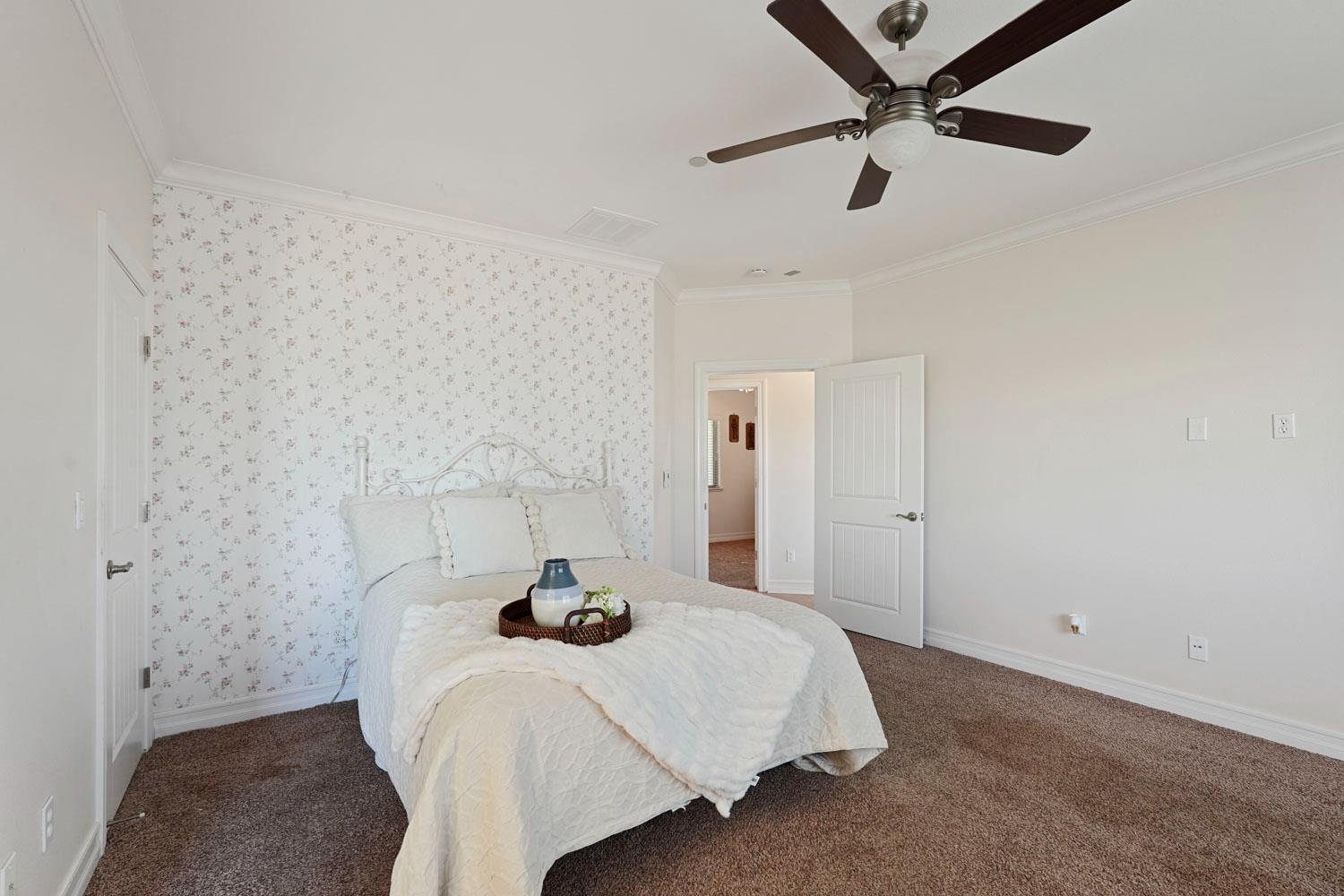 6120 Eschinger Road Elk Grove, CA 95757 - Photo 17 of 39 a bedroom with a bed and a ceiling fan