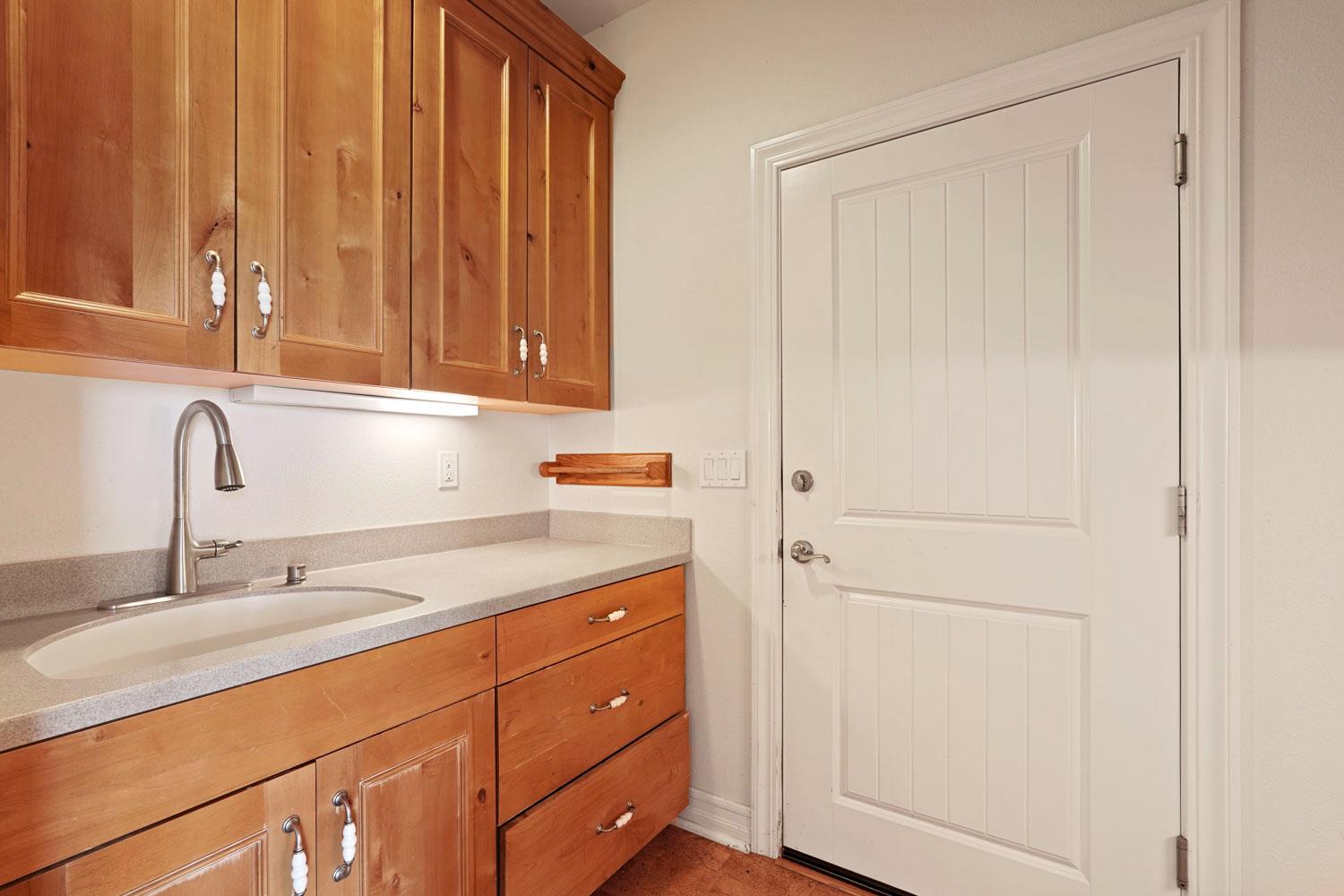 6120 Eschinger Road Elk Grove, CA 95757 - Photo 23 of 39 a kitchen with a sink and cabinets