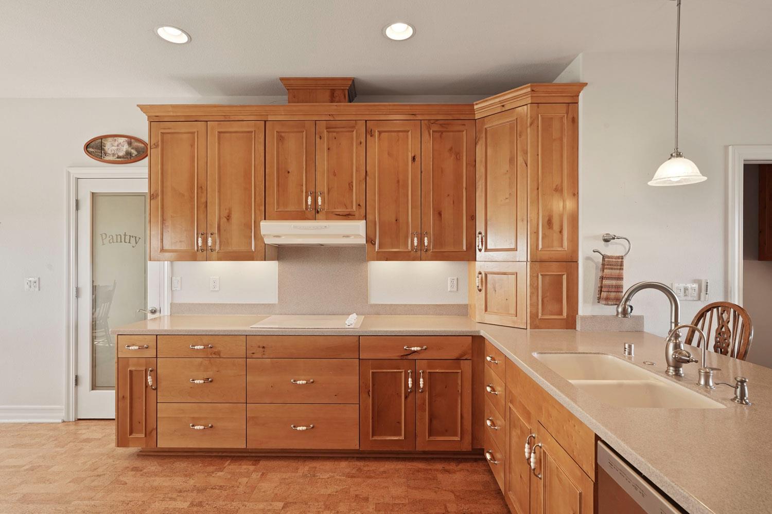 6120 Eschinger Road Elk Grove, CA 95757 - Photo 5 of 39 a kitchen with a sink cabinets and wooden floor