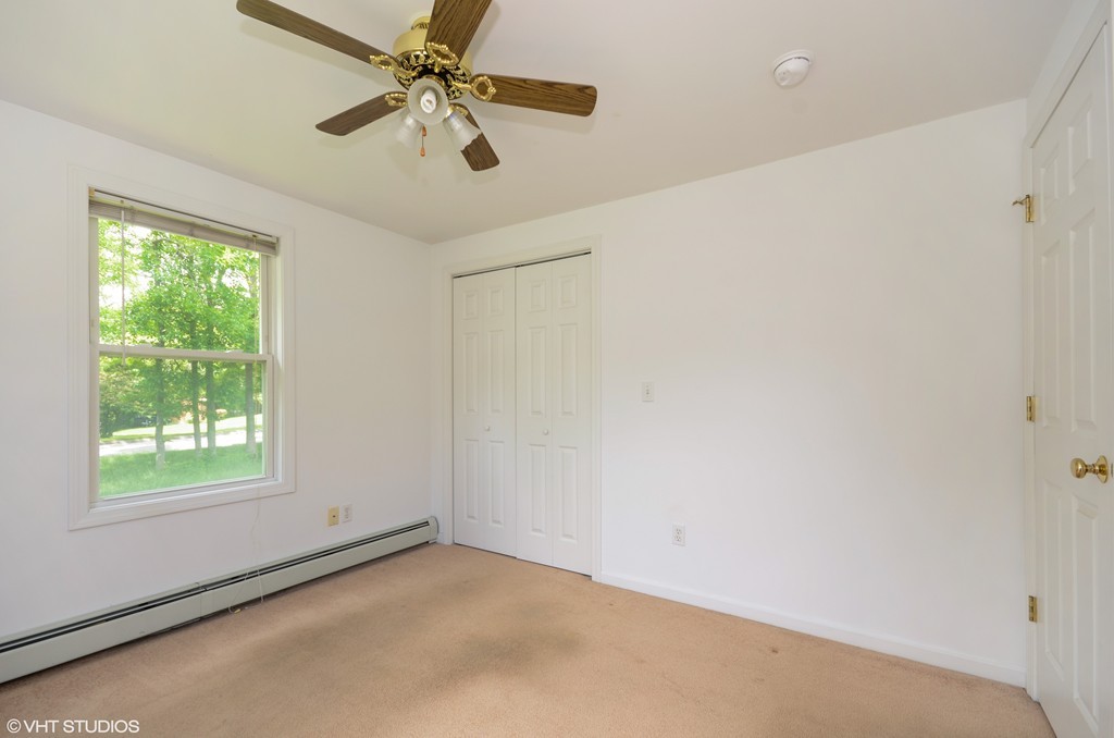 39 Boston Hill Road Fairhaven, MA 02719 - Photo 12 of 16 an empty room with windows and fan