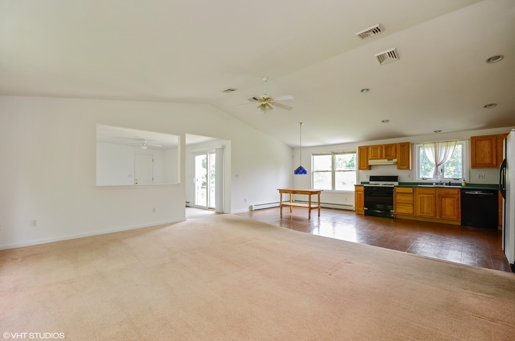 39 Boston Hill Road Fairhaven, MA 02719 - Photo 4 of 16 a view of a livingroom with furniture and a kitchen