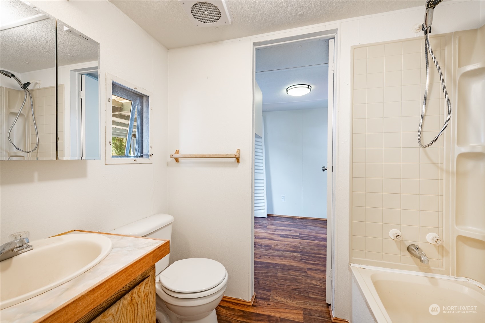 4915 Samish Way, Unit 7 Bellingham, WA 98229 - Photo 19 of 26 a bathroom with a sink a toilet and shower