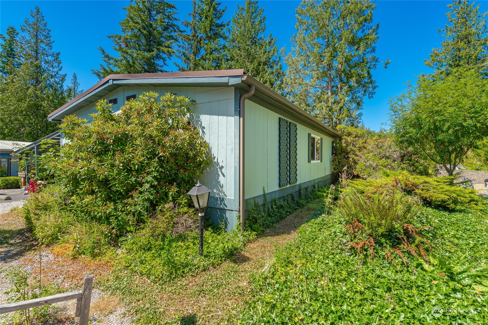4915 Samish Way, Unit 7 Bellingham, WA 98229 - Photo 21 of 26 a view of a backyard with plants