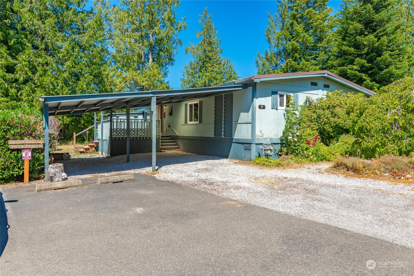 4915 Samish Way, Unit 7 Bellingham, WA 98229 - Photo 4 of 26 a view of a house with a yard and large tree