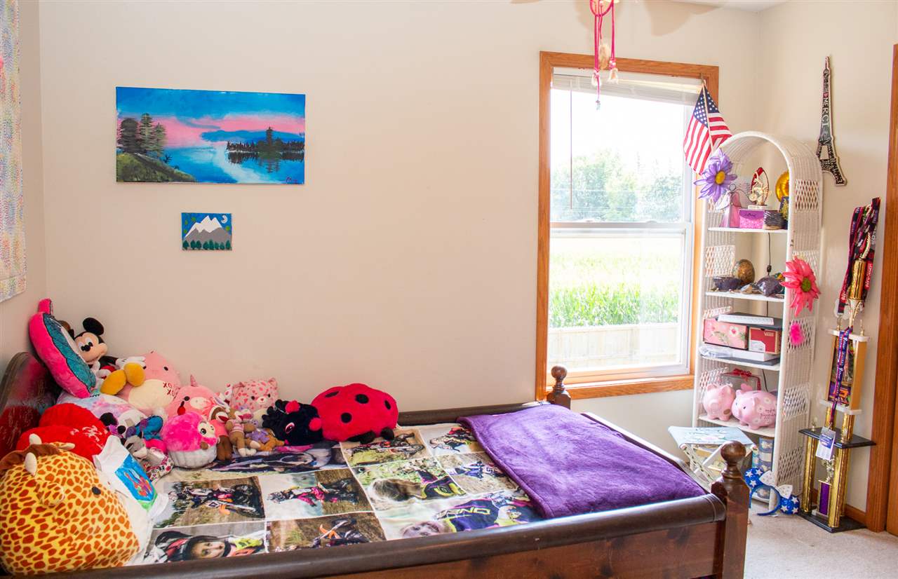 5654 Tipple Road Rockford, IL 61102 - Photo 25 of 33 a bedroom with furniture and a bed