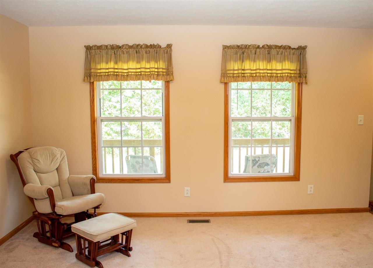 5654 Tipple Road Rockford, IL 61102 - Photo 6 of 33 a living room with furniture and a window