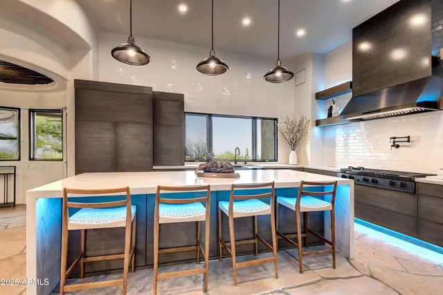 a bedroom with a bed a couch and a window