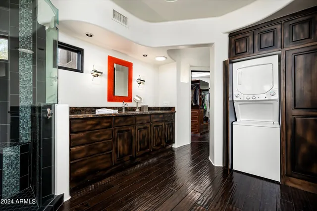 a view of a patio with chairs and plants