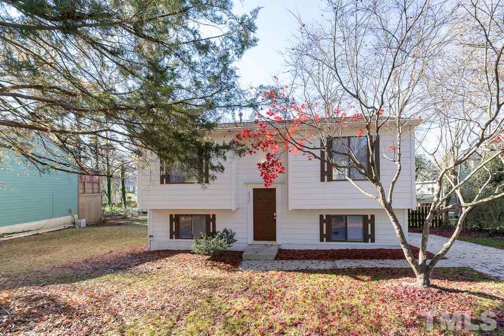 2437 Tusket Court Raleigh, NC 27613 - Photo 1 of 30 a front view of a house with a yard