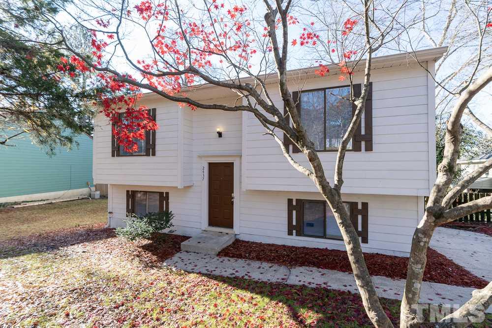 2437 Tusket Court Raleigh, NC 27613 - Photo 2 of 30 a front view of a house with garden