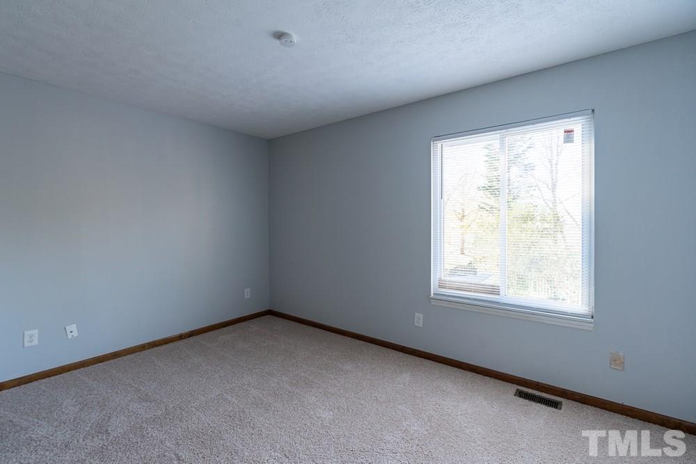 2437 Tusket Court Raleigh, NC 27613 - Photo 15 of 30 an empty room with a window