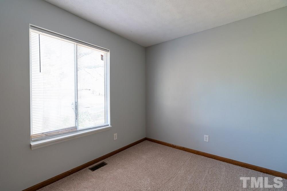 2437 Tusket Court Raleigh, NC 27613 - Photo 18 of 30 an empty room with a window