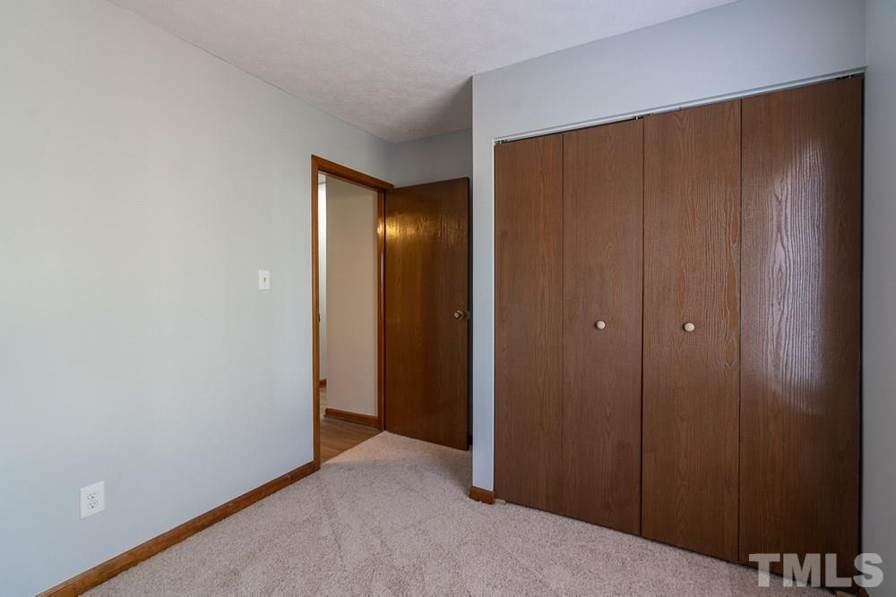 2437 Tusket Court Raleigh, NC 27613 - Photo 19 of 30 a view of hallway with closet area