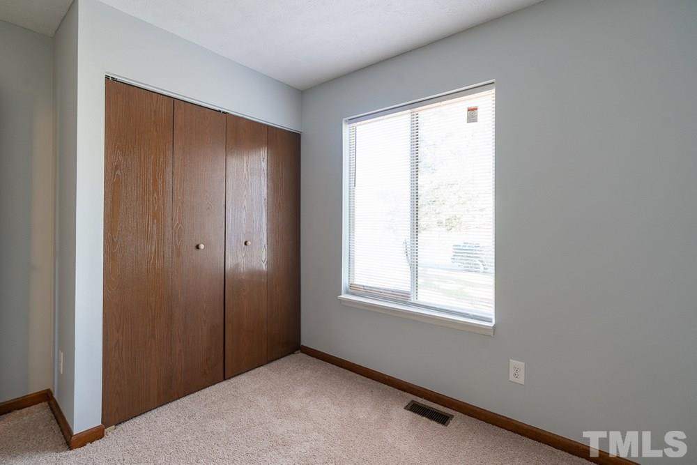 2437 Tusket Court Raleigh, NC 27613 - Photo 20 of 30 a view of an empty room with a window