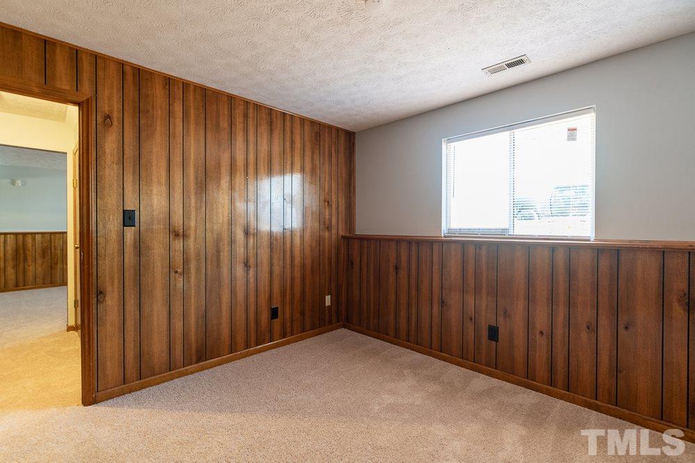 2437 Tusket Court Raleigh, NC 27613 - Photo 22 of 30 an empty room with windows
