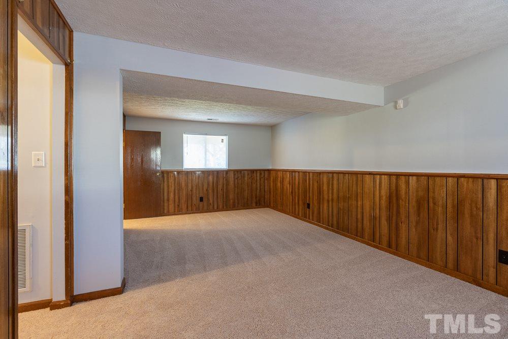 2437 Tusket Court Raleigh, NC 27613 - Photo 24 of 30 a view of an empty room and window