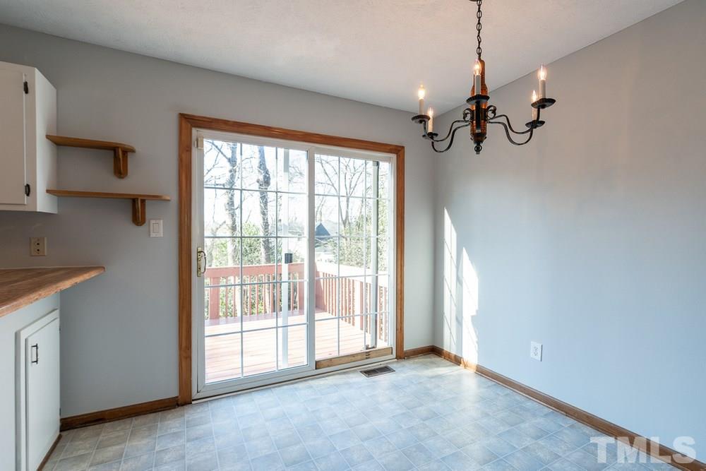 2437 Tusket Court Raleigh, NC 27613 - Photo 7 of 30 a view of a livingroom with a chandelier