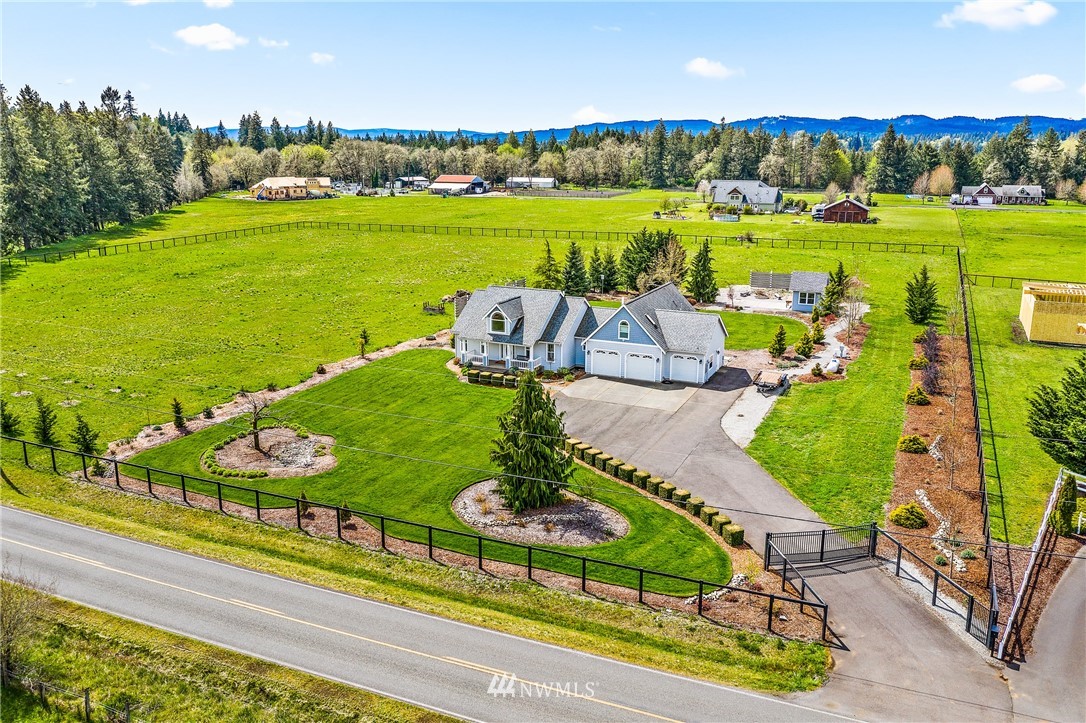 13323 Erskine Road Southwest Rochester, WA 98579 - Photo 2 of 30 an aerial view of a house with a garden and houses
