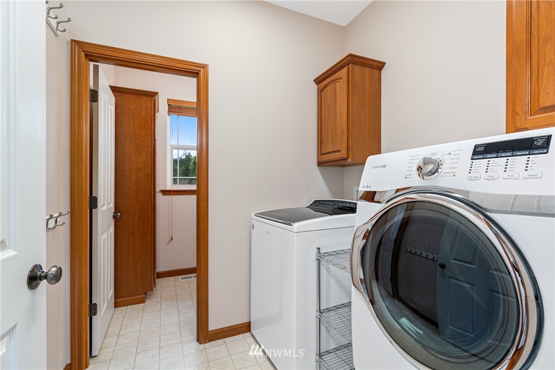 13323 Erskine Road Southwest Rochester, WA 98579 - Photo 13 of 30 a utility room with dryer and washer