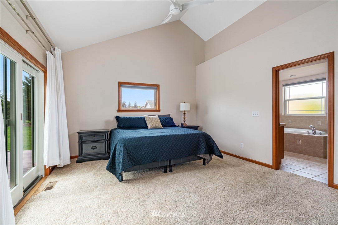 13323 Erskine Road Southwest Rochester, WA 98579 - Photo 14 of 30 a bed room with a bed and a window