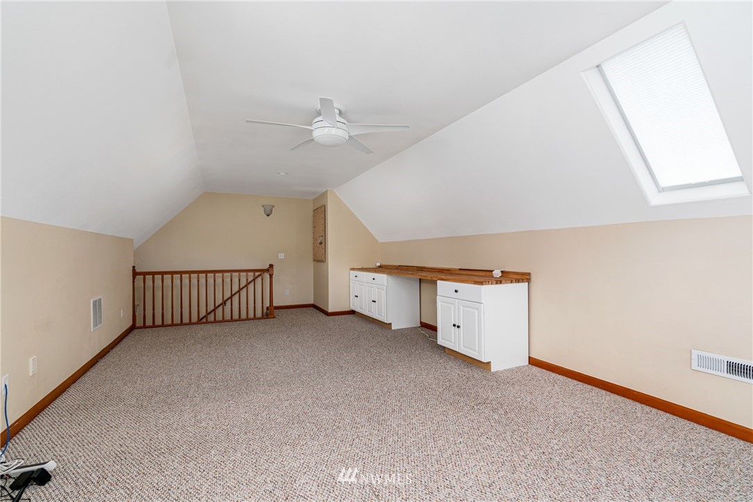 13323 Erskine Road Southwest Rochester, WA 98579 - Photo 19 of 30 an empty room with windows