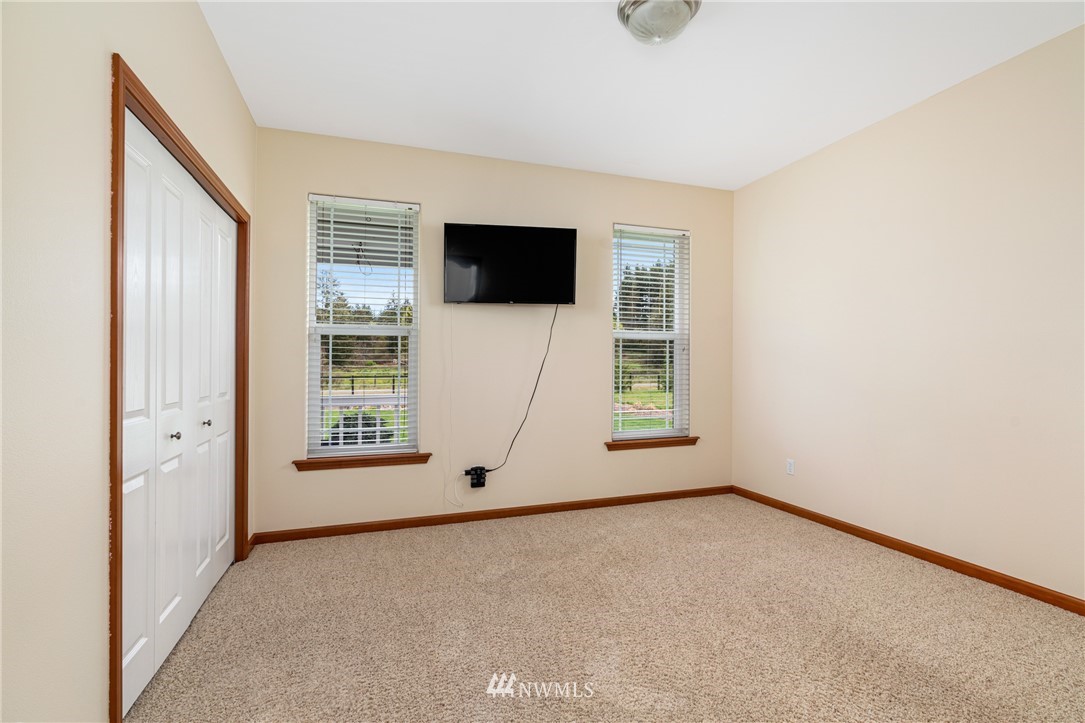 13323 Erskine Road Southwest Rochester, WA 98579 - Photo 20 of 30 an empty room with windows and closet