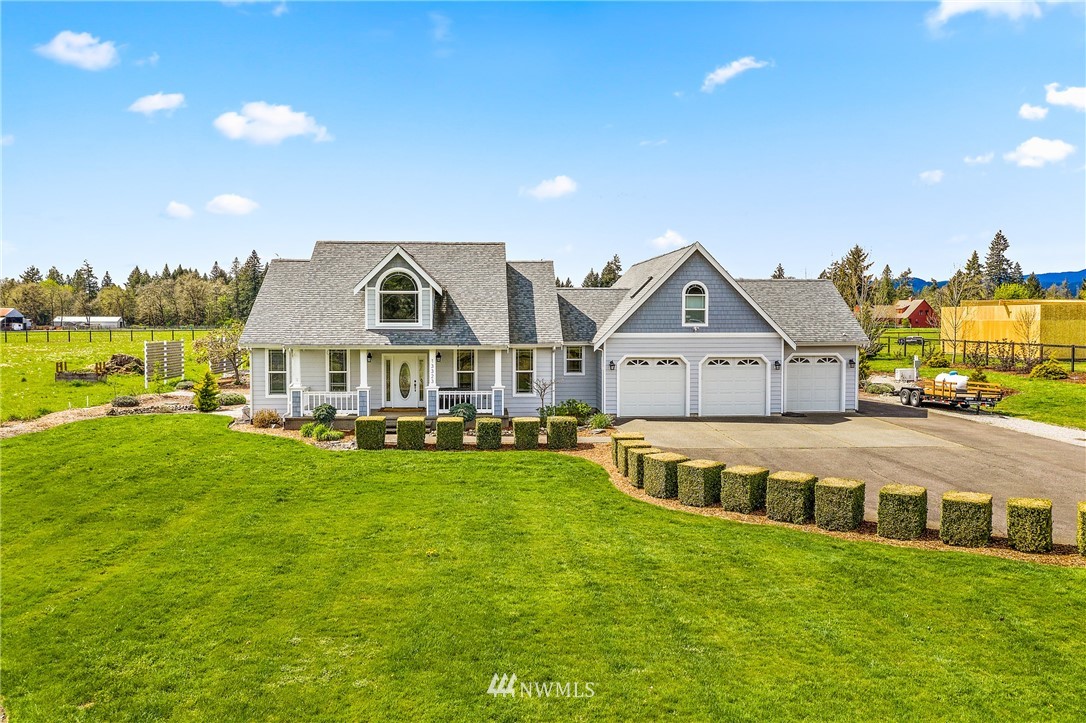 13323 Erskine Road Southwest Rochester, WA 98579 - Photo 3 of 30 a front view of house with yard and lake view