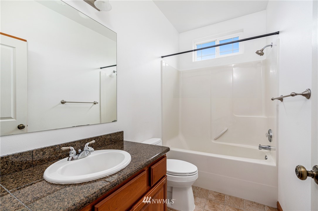 13323 Erskine Road Southwest Rochester, WA 98579 - Photo 21 of 30 a bathroom with a sink and a mirror