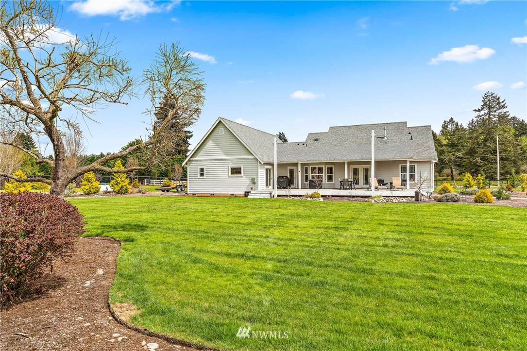 13323 Erskine Road Southwest Rochester, WA 98579 - Photo 23 of 30 a view of a house with a big yard