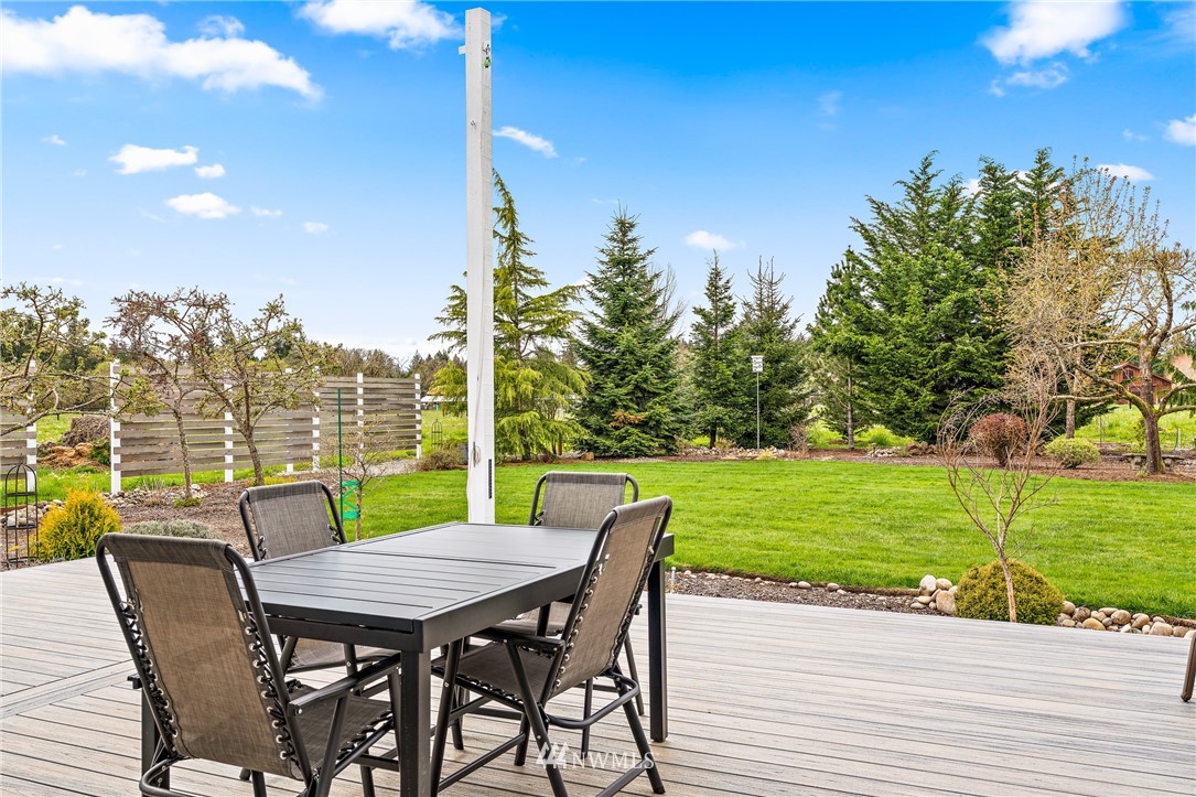 13323 Erskine Road Southwest Rochester, WA 98579 - Photo 24 of 30 a view of a patio with a table and chairs