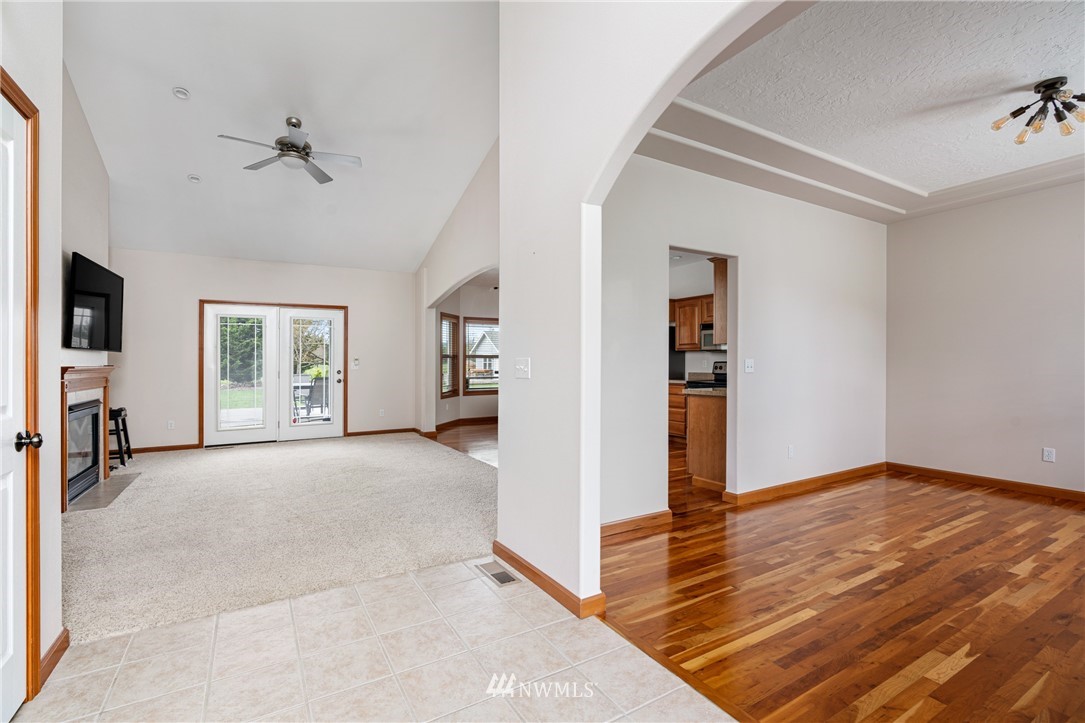 13323 Erskine Road Southwest Rochester, WA 98579 - Photo 5 of 30 a view of livingroom with hardwood floor and a ceiling fan