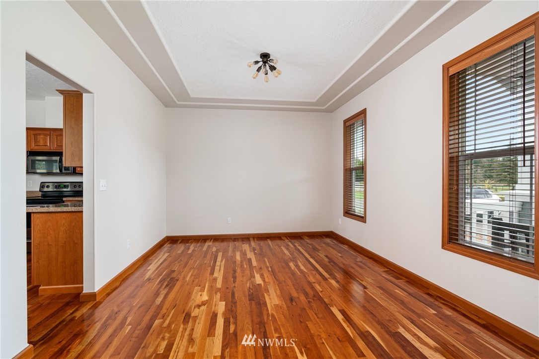 13323 Erskine Road Southwest Rochester, WA 98579 - Photo 6 of 30 a view of empty room with wooden floor and fan