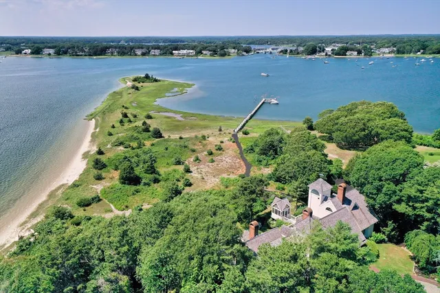 an aerial view of a houses with outdoor space and lake view