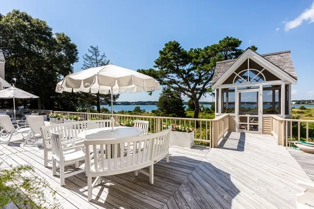 a view of balcony with outdoor seating and wooden floor