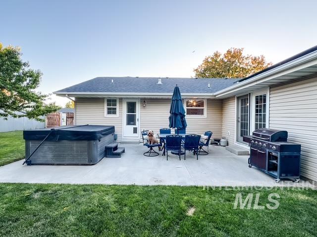 808 O'Leary Way Twin Falls, ID 83301 - Photo 30 of 37 Expansive concrete patio featuring a built-in hot tub, providing ample outdoor living space