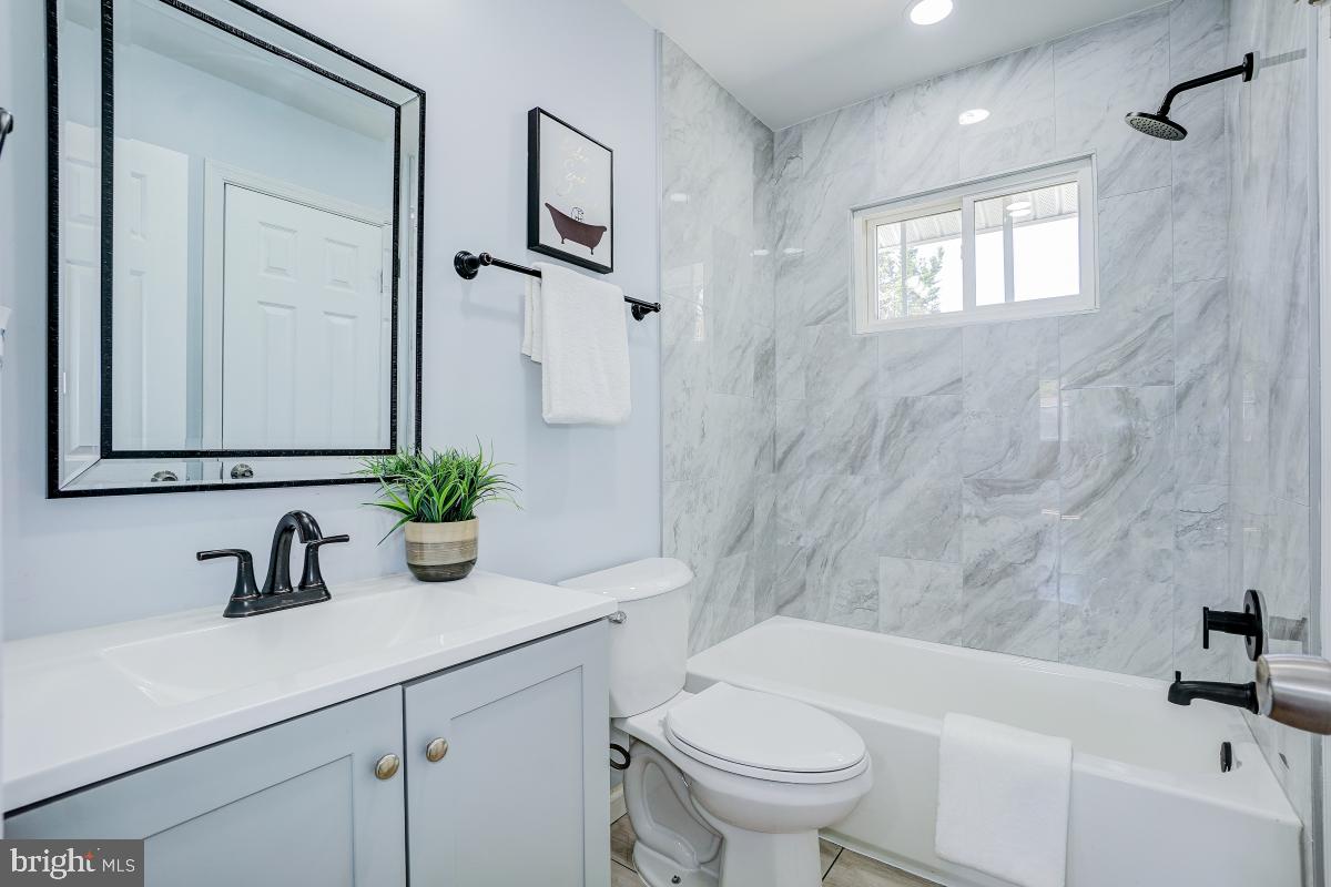 2654 Cory Terrace Silver Spring, MD 20902 - Photo 14 of 32 a bathroom with a sink a toilet and shower