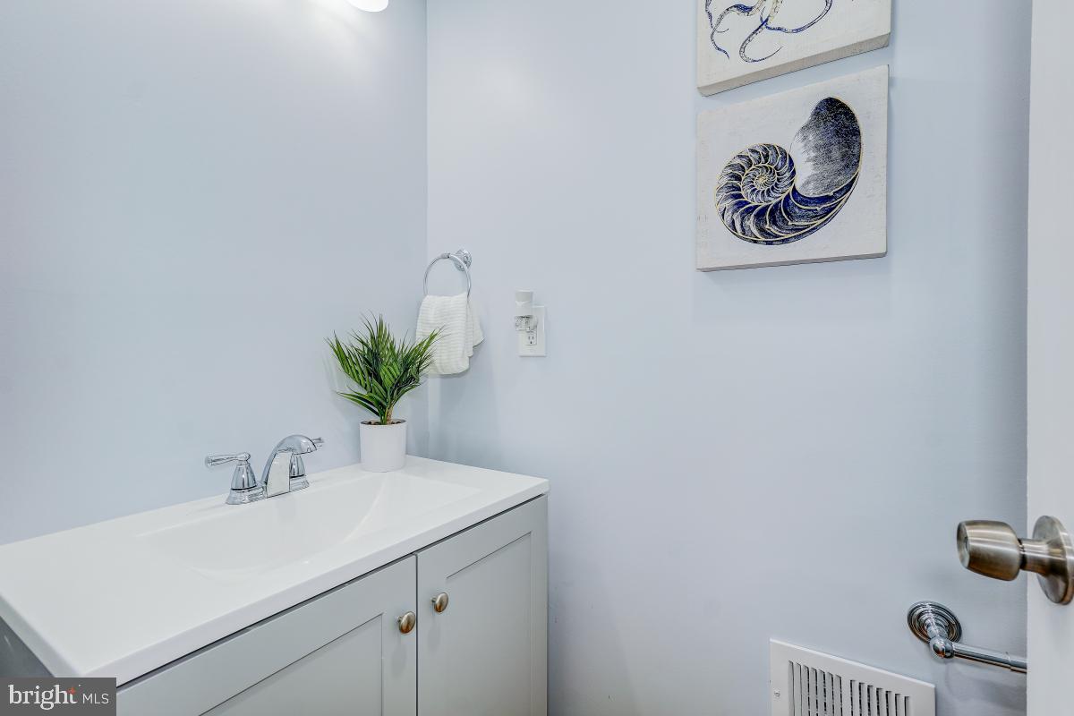 2654 Cory Terrace Silver Spring, MD 20902 - Photo 18 of 32 a bathroom with a sink and a mirror