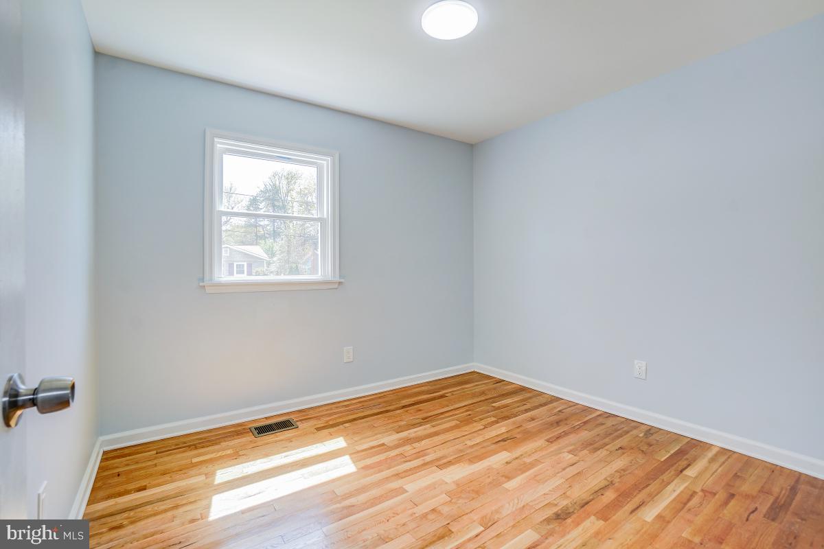 2654 Cory Terrace Silver Spring, MD 20902 - Photo 19 of 32 a view of a room with wooden floor and fan